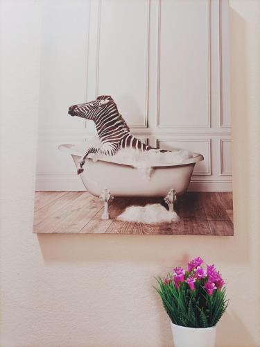 a painting of a zebra in a bath tub at Villemar in Isola delle Femmine