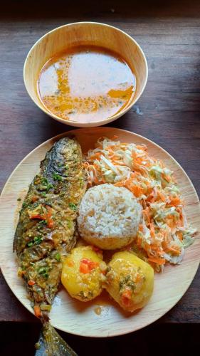 a plate of food with fish and vegetables on a table at The Humpback Turtle in El Valle