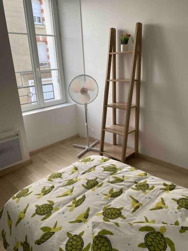 Ένα ή περισσότερα κρεβάτια σε δωμάτιο στο L'appartement des tortues