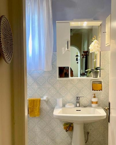a bathroom with a sink and a mirror at Mon Reve House in Corfu