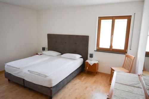 Postel nebo postele na pokoji v ubytování Villa Paula