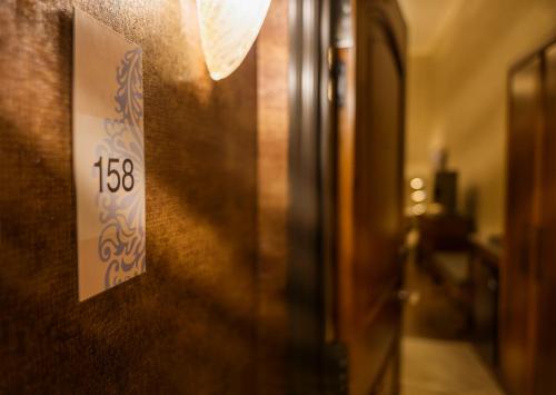 a door with a sign on a wall at Allegretto Vineyard Resort Paso Robles in Paso Robles