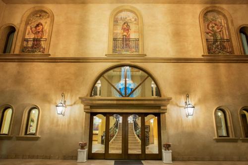 an entrance to a building with a stained glass window at Allegretto Vineyard Resort Paso Robles in Paso Robles