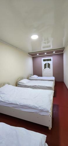 Postel nebo postele na pokoji v ubytování Sim-Sim Hostel