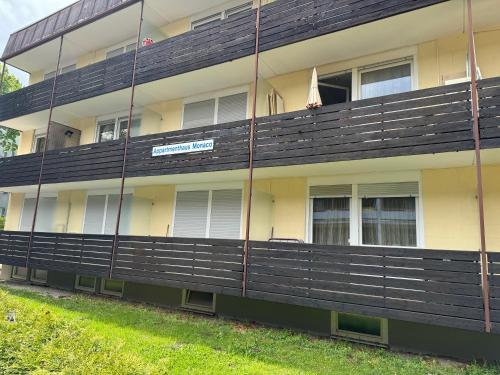 an apartment building with a black and yellow facade at Boho Apartment Birkenstöckl in Bad Reichenhall