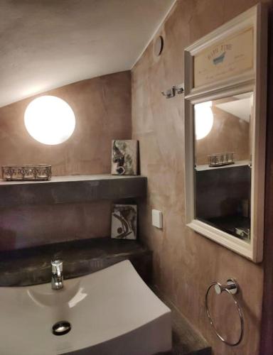 a bathroom with a sink and a mirror at Korasida View Apartment in Akhladherí