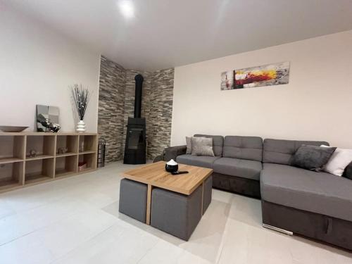 a living room with a couch and a coffee table at Maison vue exceptionnelle in Niaux