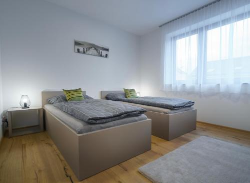 Postel nebo postele na pokoji v ubytování Apartments Poděbradova Premium