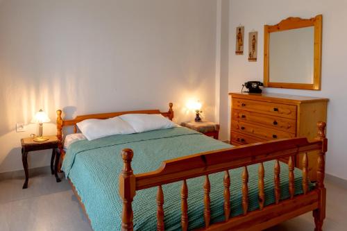 Postel nebo postele na pokoji v ubytování Jenny's Αpartment
