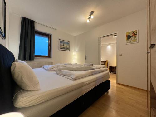 Katil atau katil-katil dalam bilik di Gemütliche 2-Zimmer-Wohnung by Rabe - Innenhof, Smart-TV, Netflix