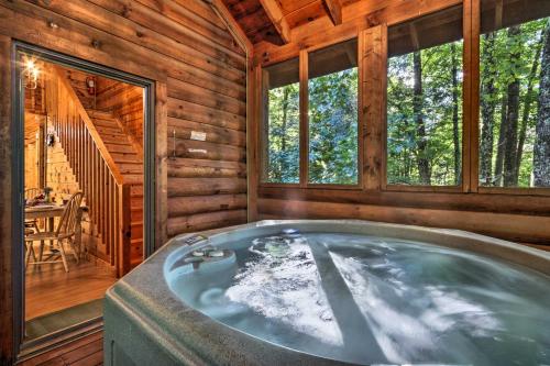 a jacuzzi tub in a log cabin at Cozy Mountain Cabin in PERFECT location in Sevierville