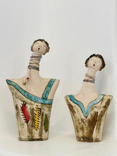 two vases are sitting next to each other at Gerani Deluxe Houses in Astypalaia Town
