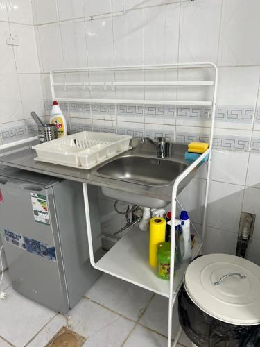a bathroom with a sink and a toilet at Al Salehiyah 2 in Medina
