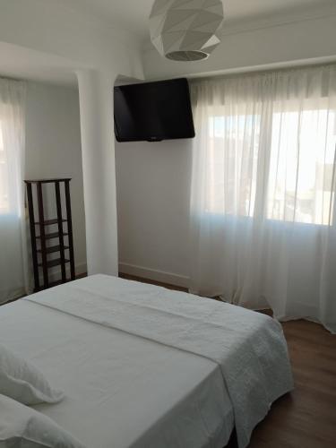 Кровать или кровати в номере Apartamento Claudia