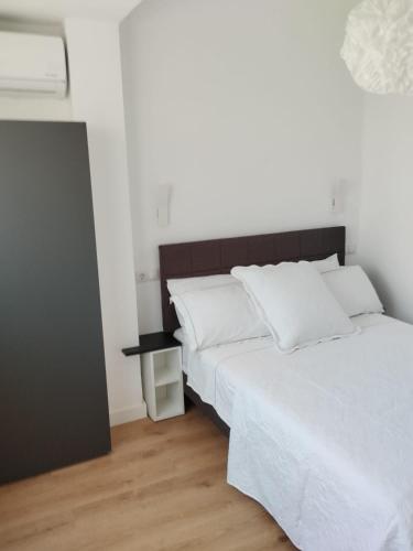 Кровать или кровати в номере Apartamento Claudia