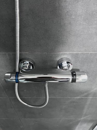 a metal towel rack on a wall in a bathroom at ROYAL RACiING SUITE TOP 4 in Judenburg