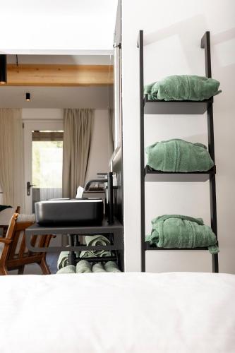 a room with a stack of green pillows at Michlhaus nature and suites in Aldino