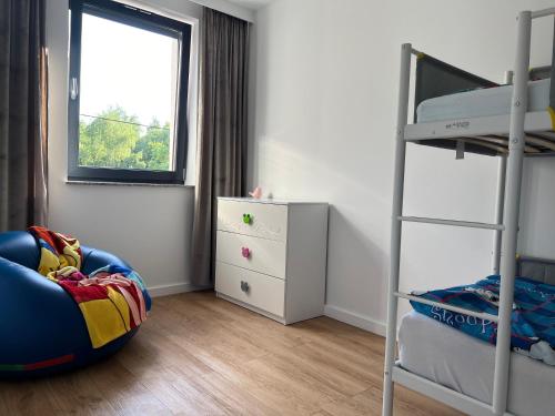 a small bedroom with a bunk bed and a bunk bedskirts at Apartament Jerzyn in Jerzyn