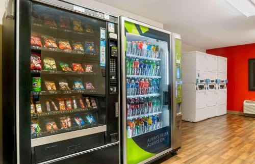 a large soda machine in a store with drinks at Extended Stay America Select Suites - Grand Rapids - Kentwood in Grand Rapids