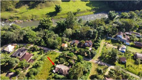 an aerial view of a house with a red roof at Casa Barra do Sana in Sana