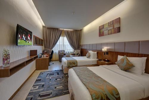 Postel nebo postele na pokoji v ubytování Western Hotel - Ghayathi