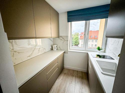 Kuchyň nebo kuchyňský kout v ubytování Apartament przy Plaży