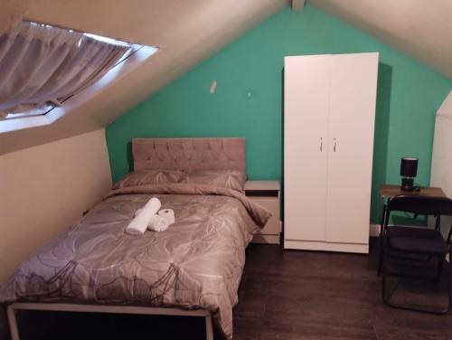 a bedroom with a bed with two teddy bears on it at Double-Bedroom C4 Manchester Close To Bolton Centre in Little Hulton