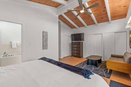 a bedroom with a bed and a ceiling fan at Upscale Modern Home with perfect triad location in High Point