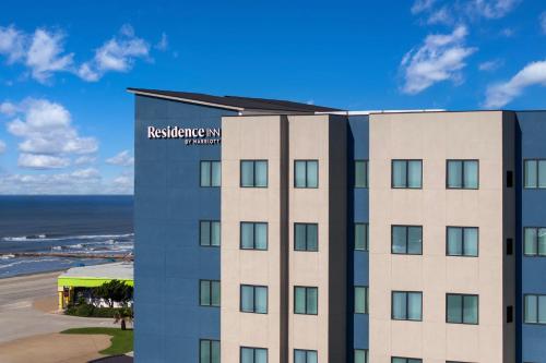 a hotel with the beach in the background at Residence Inn by Marriott Galveston Island in Galveston