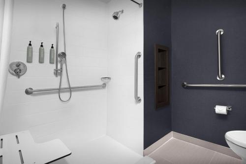 a bathroom with a shower and a sink at Residence Inn by Marriott Galveston Island in Galveston