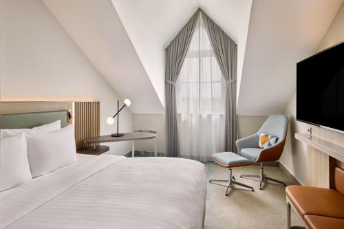 Postel nebo postele na pokoji v ubytování Courtyard by Marriott Magdeburg