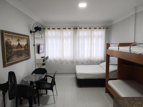 Ένα ή περισσότερα κρεβάτια σε δωμάτιο στο Apartamento Estúdio na Pitangueiras