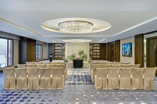 a conference room with rows of chairs and a chandelier at Sheraton Imperial Kuala Lumpur Hotel in Kuala Lumpur