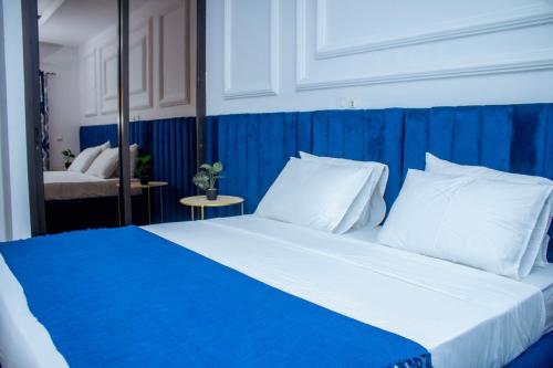 Ένα ή περισσότερα κρεβάτια σε δωμάτιο στο La Haussmannienne Place