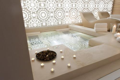 a living room with a table with candles on it at Residence Villa Bottacin in Trieste