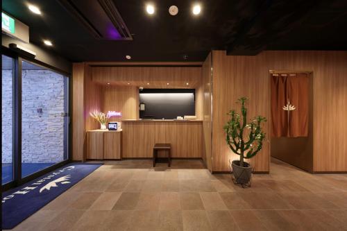 TV a/nebo společenská místnost v ubytování Nipponbashi Crystal Hotel