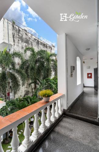 a balcony with a view of a building at 5H Garden in Ho Chi Minh City