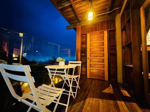 a room with chairs and a table in a room at SANKARA GARDEN in Pantai