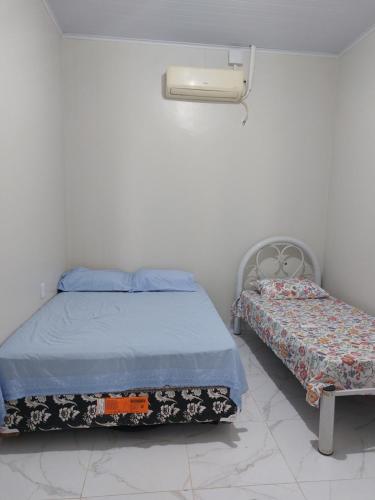 Ένα ή περισσότερα κρεβάτια σε δωμάτιο στο Casa Hostel Familiar