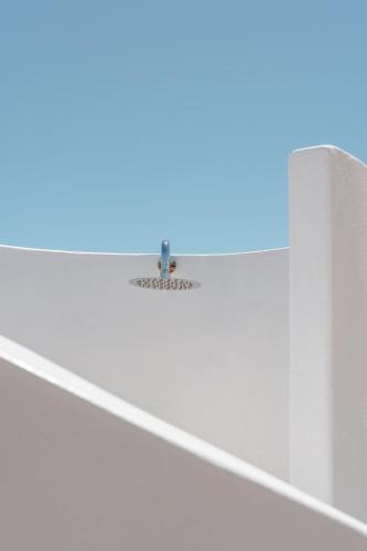 a metal fixture on top of a white staircase at Thalelion 3 bedroom Villas with private pool and Jacuzzi in Naxos Chora