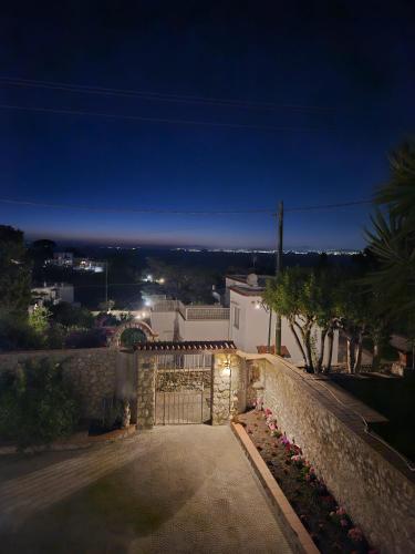 a driveway leading to a house at night at Il Portico B&B Capri in Capri