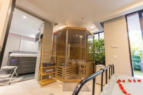a room with a glass display case in a house at Laissepassetemps in Marseille
