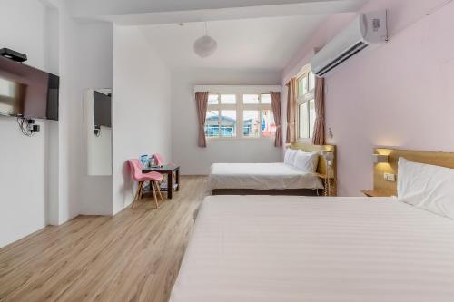Postel nebo postele na pokoji v ubytování 5-1 Homestay