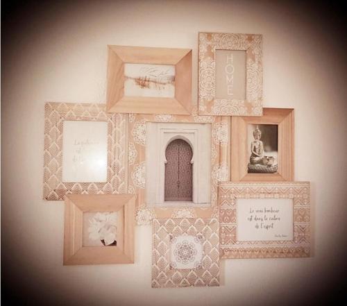 a collage of picture frames on a wall at Appartement Alpes Maritimes in Saint-Paul-de-Vence