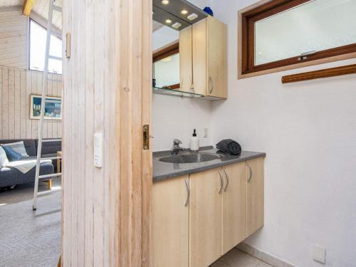 a kitchen with a sink in a room at 4 star holiday home in Juelsminde-By Traum in Sønderby