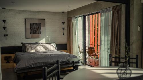 The Hotel Journal Chiangmaiにあるベッド