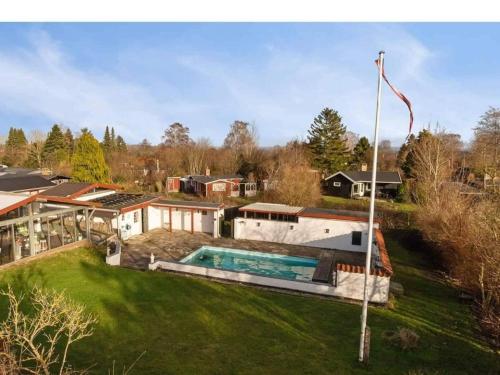an aerial view of a house with a swimming pool at 5 person holiday home in Frederiksværk-By Traum in Frederiksværk