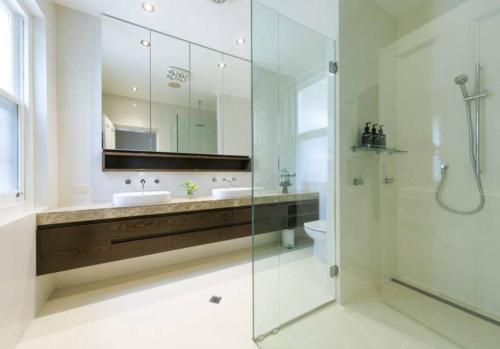 a bathroom with a glass shower and a sink at Tanunda House - Luxury 5 BR in Barossa Wine Region in Tanunda