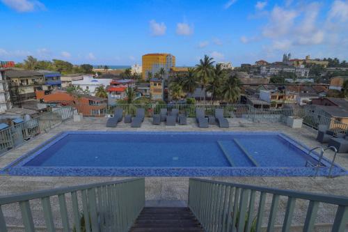 a swimming pool on the roof of a building at Wonmi Residency in Galle