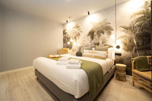 a large bedroom with a large bed in a room at El Bosque Del Puerto in Gijón